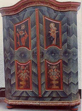 A C18th European painted folk wardrobe with Cubist patterns