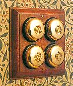 Arts & Crafts Movement style elegant polished chrome 4 domed nipple electric light switch on antique mahogany wooden backplate