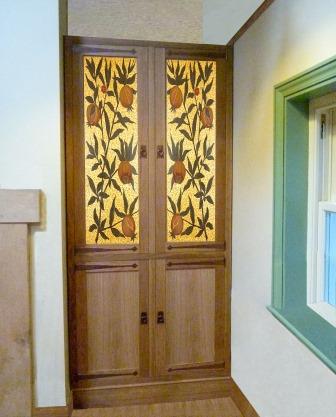 New Arts & Crafts Movement oak built-in wardrobe with gold painted panels