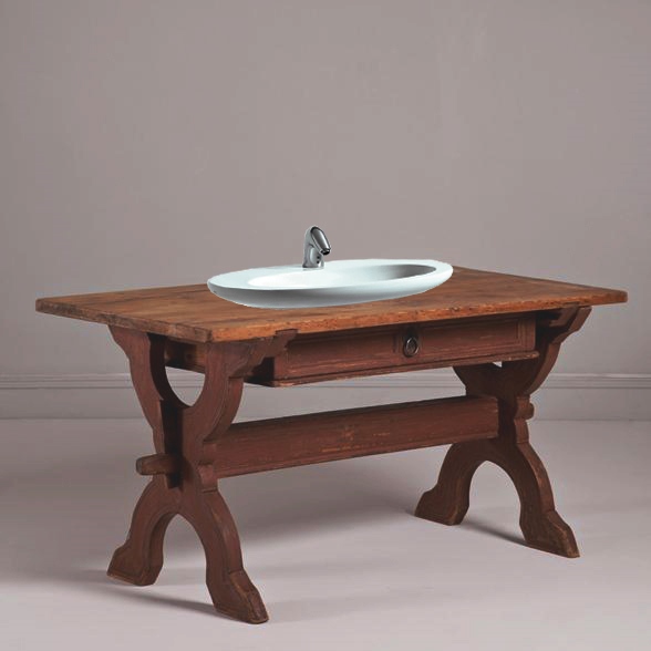 Rustic wooden table used as a vanity unit