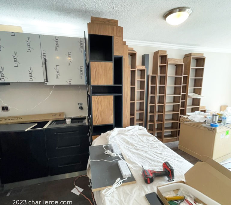 The new Paul Frankl Art Deco Skyscraper style wooden & painted lacquered bookcase desk/table being installed in the appartment