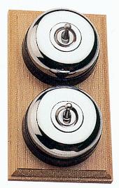 Arts & Crafts Movement style elegant polished chrome double domed nipple electric light switch on square light oak wooden backplate