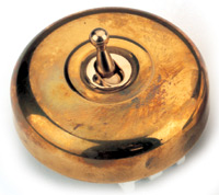 Arts & Crafts Movement style plain unlacquered brass single domed nipple electric light switch
