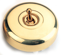 Arts & Crafts Movement style antique plain brass single domed nipple electric light switch