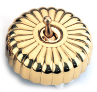 Arts & Crafts Movement style elegant brass fluted single domed nipple electric light switch