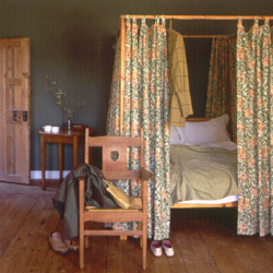 One of our CFA Voysey Oak Oak carver chairs from a Sanderson's advert