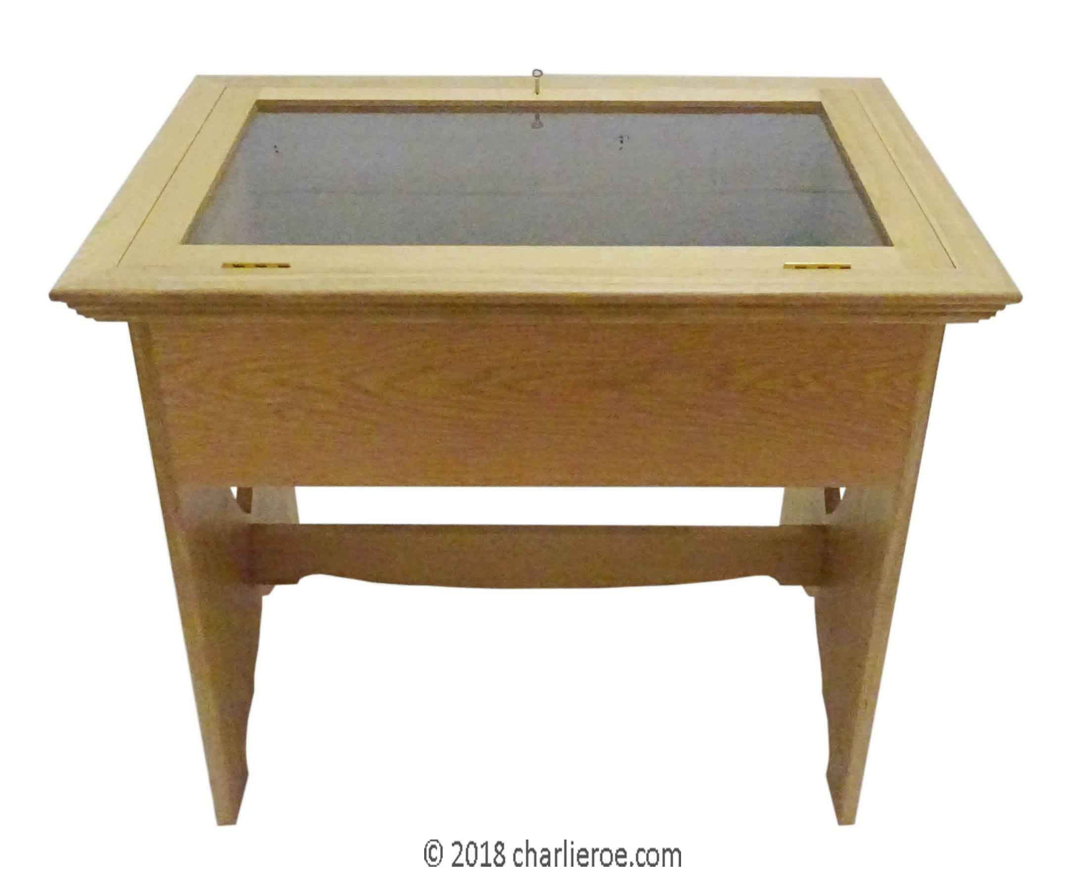 New CFA Voysey Arts & Crafts Movement medium oak display table with end 'faces', for showing memorabilia