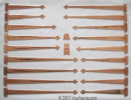 new CFA Voysey Arts and crafts Movement copper strap hinges for an oak fitted kitchen furniture