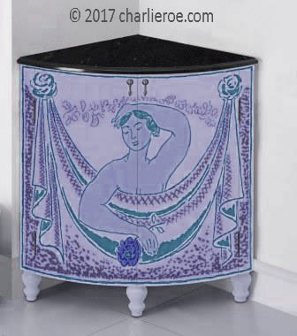 new Bloomsbury Group style painted quadrant corner cupboard on turned legs with woman and swag design on the doors