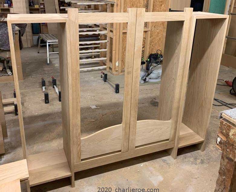 Initial assembly of the carcase & middle doors for a New CR Mackintosh oak wood finish freestanding display cabinet bookcase with stained glass door panels